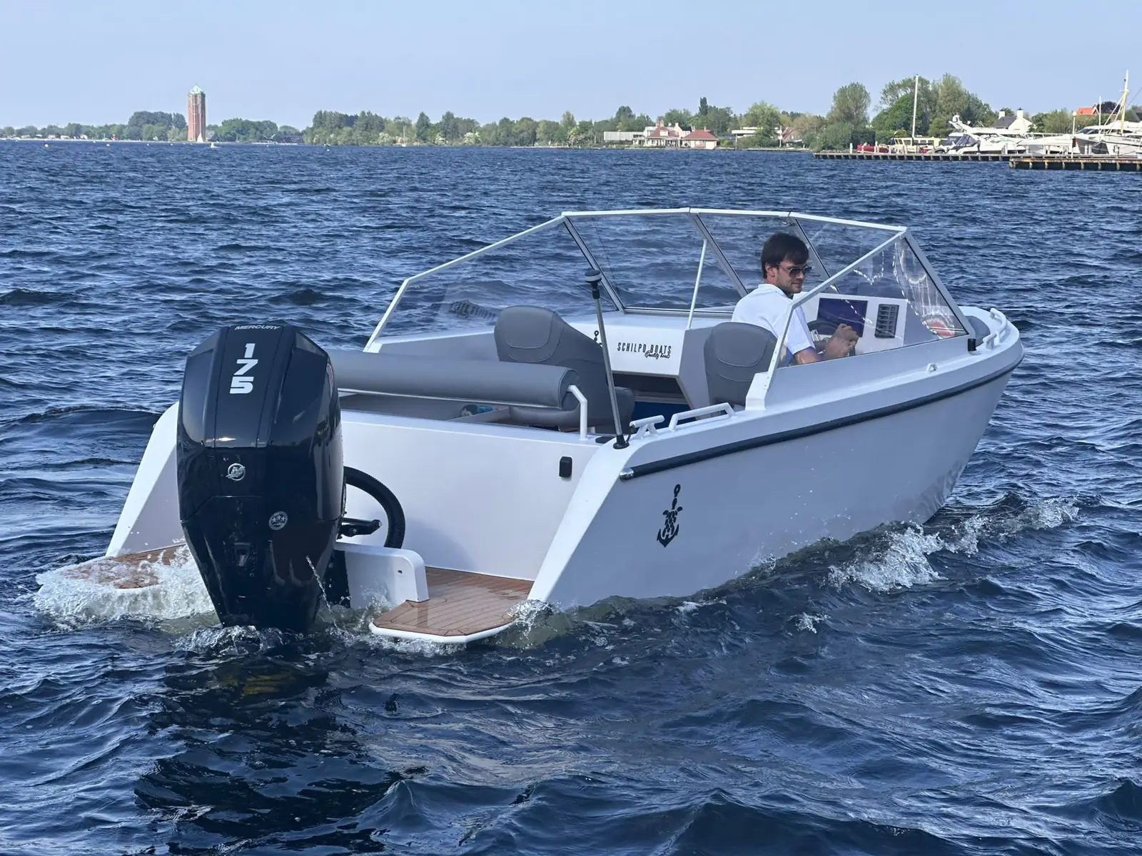 White motorboat viewed from the stern